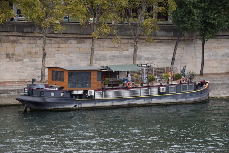 River House Boat Nina docked in the Seine River near Eiffel Tower.jpg