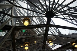 Inside Eiffel Tower Ground Level Looking Upwards.jpg
