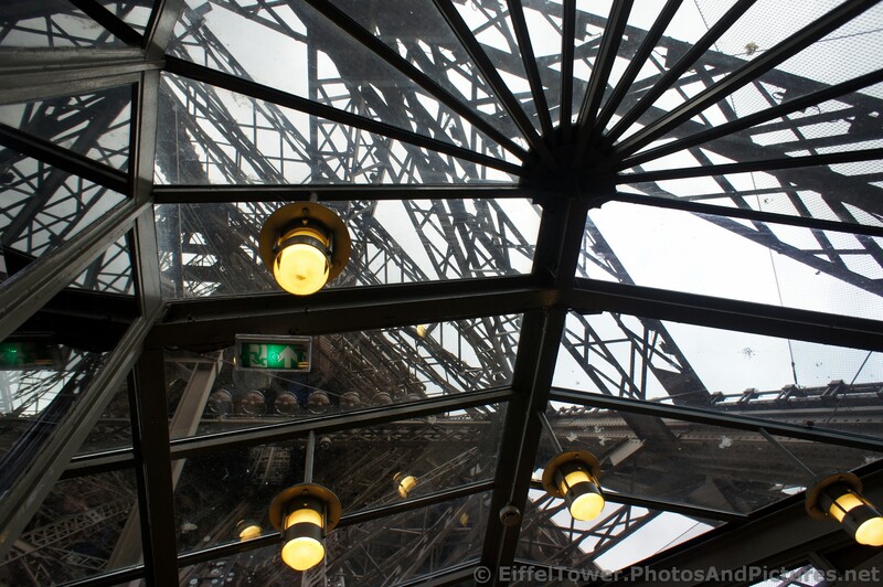 Inside Eiffel Tower Ground Level Looking Upwards.jpg