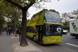 L open Tour Bus by CityVision stops in front of the Eiffel Tower.jpg
