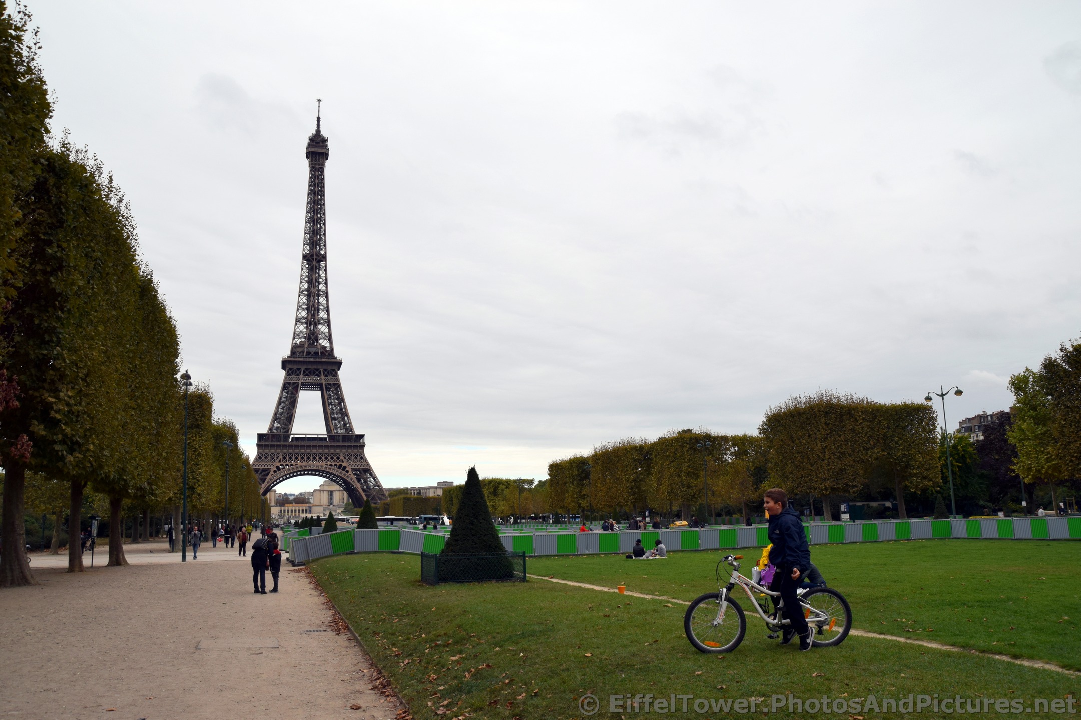 Boy on Bike at Champ de Mars near Eiffel Tower.jpg