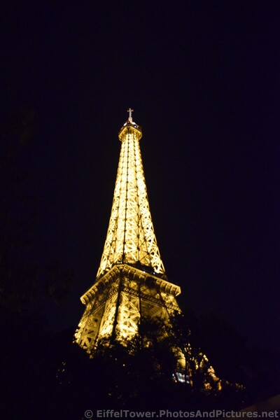 Cross atop of Eiffel Tower at Night.jpg