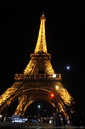 Eiffel Tower at Night next to the Moon Red Light on Pont d'Lena.jpg