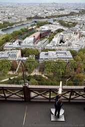 Kid looking through Telescope at Eiffel Tower Second Level.jpg