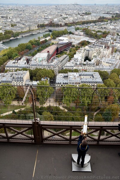 Kid looking through Telescope at Eiffel Tower Second Level.jpg