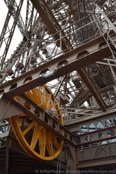 Yellow Mechanical Gear Wheel of Eiffel Tower on Second Floor.jpg